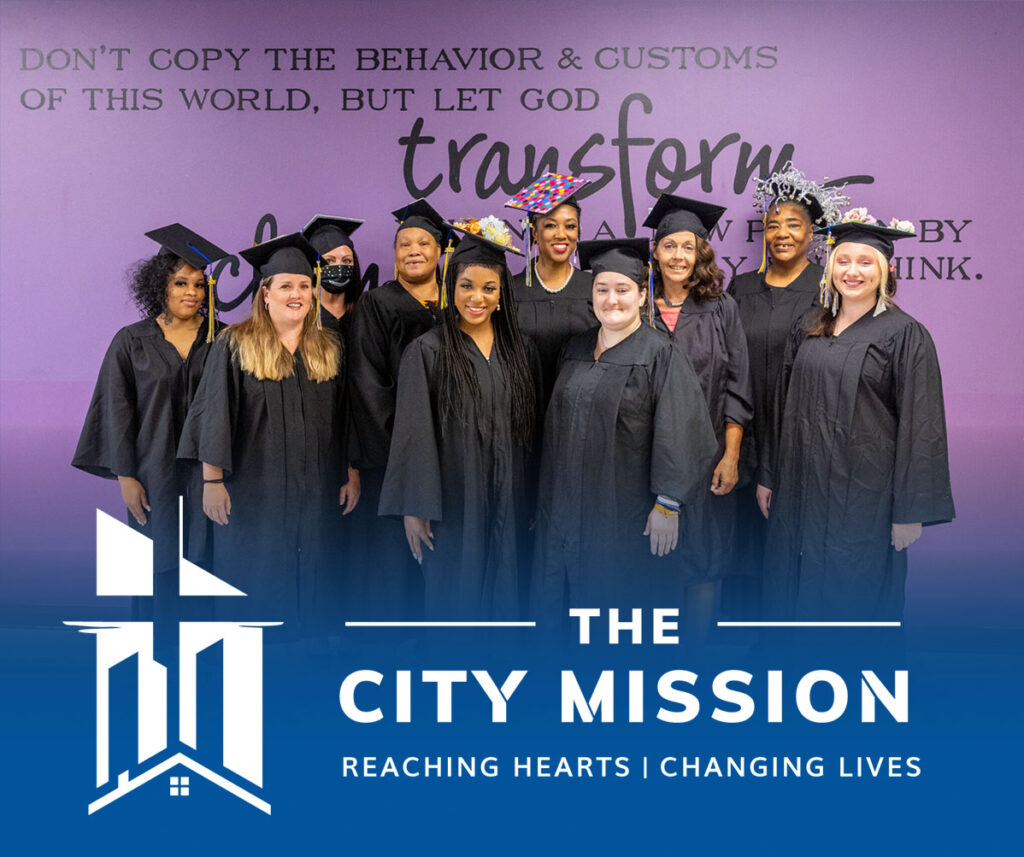 the city mission Lauras Home grads with logo