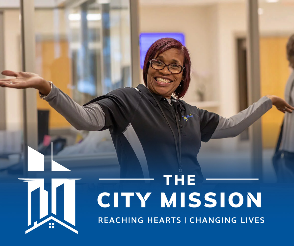 the city mission Lauras Home grads with logo
